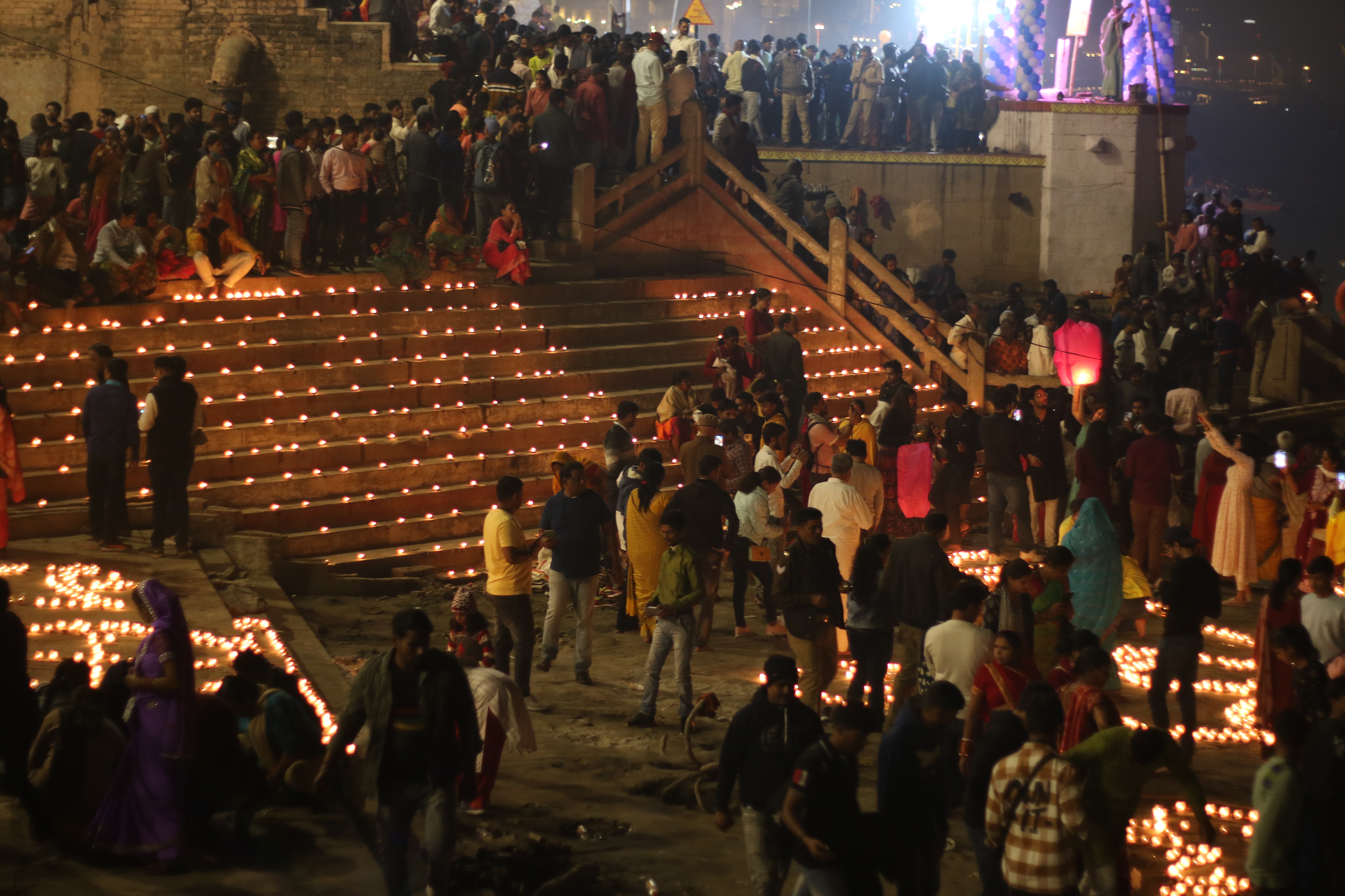 Close night up view of beautifully decorated steps with patterns of small clay lamps