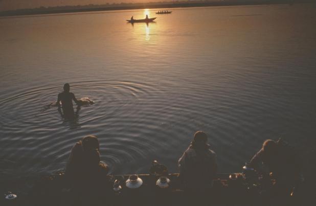 Wooden boats lined up along the Ganga riverfront at sunrise
